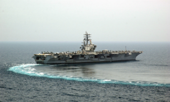 The aircraft Carrier Ronald Reagan (CVN76) performs a turn at sea. The U.S.S. Carl Vinson (CVN 70) is keeping the peace in the Western Pacific at this time.
