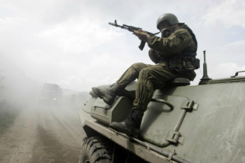 A Russian soldier rides on an armored vehicle in this file image.