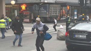 People flee as the terrorist attacker drives into a department store.