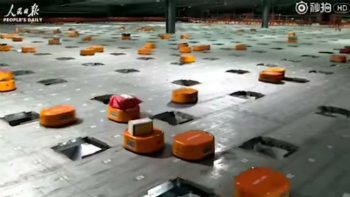 The little orange robots can sort 200,000 parcels per day, faster and with greater accuracy than humans.