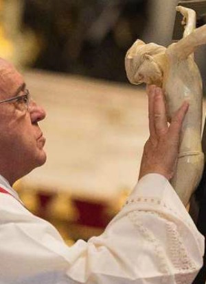 Pope Francis venerates the cross on Good Friday 2015 (L'Osservatore Romano).