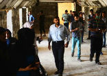 Image of Young Muslims join Christians to rebuild a destroyed monastery in Iraq.
