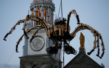 The giant spider woke up on cue, and walked into the streets below, amazing the crowd. But not everybody appreciated the display.