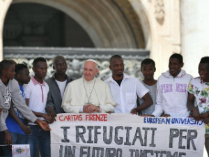 Pope Francis with refugees.
