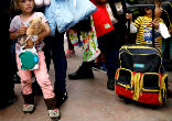 Image of Many from the caravan fleeing violence were traveling with young children. 