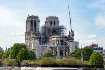 Image of Notre Dame Cathedral 
in Paris the day after a massive fire damaged parts of the roof and structure