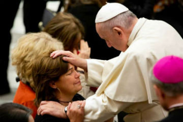 Image of Pope Francis blesses woman