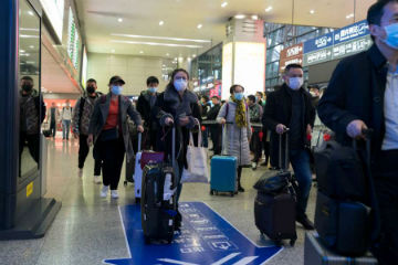 Image of Travelers wearing masks