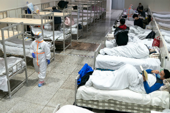 Image of Patients in a hospital in China remain under quarantine while the illness spreads. 