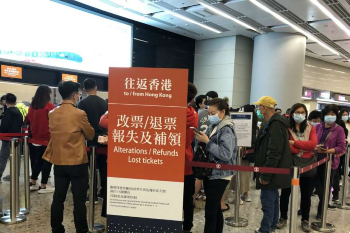 Image of Hong Kong residents queuing to refund their bullet train tickets to the mainland in West Kowloon railway station bc coronavirus Jan 25 2020