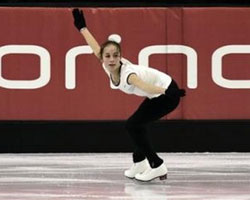 Image of U.S. FIGURE SKATER PERFORMS – Kimmie Meissner performs during the women's long program at the U.S. figure skating championships in St. Louis Jan. 14. The 16-year-old skater from the Archdiocese of Baltimore is a competitor in the XX Winter Olympic Games in Turin, Italy. (CNS photo/Reuters) 
