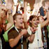 Image of World Youth Day pilgrims from St. Cloud, Minn., raise their arms during a catechetical session in Dusseldorf, Germany, Aug. 17, 2005. (CNS photo)