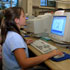 Image of CHILD LOGS ONTO INTERNET - A child uses the computer area at the Quince Orchard Public Library in Gaithersburg, Md., in this 2003 photo. Linda Pacheco, assistant director of public programs for the Bristol County Sheriff's Office in Massachusetts, told Providence Diocese leaders that students rarely realize that the information they post and messages they send on the Internet can be viewed by millions of people, and put them at risk. (CNS)
