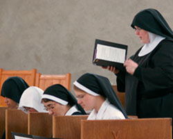 Image of POSTULANT TALKS WITH BENEDICTINE NUN AT COLORADO ABBEY
Postulant Angela Read, right, talks with Benedictine Sister Maria-Walburga Schortemeyer about fixing a tractor at the Abbey of St. Walburga in Virginia Dale, Colo. The Benedictine sisters wear a wimple and veil while working and don a complete religious habit for prayer. (CNS/Wyoming Catholic Register)
