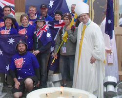 Image of BISHOP WITH YOUTH DAY PILGRIMS - Auxiliary Bishop Anthony C. Fisher of Sydney, right, coordinator of World Youth Day 2008, which will take place July 15-20, is pictured with Australian pilgrims at World Youth Day in Cologne, Germany, last year. Bishop Fisher said the first International World Youth Day ever held in Australia will provide an opportunity for young people to learn about and strengthen their faith and to spread that faith to those 