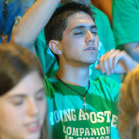 Image of YOUNG MAN PRAYS DURING YOUTH CONFERENCE – A young man prays during the Steubenville of the Rockies Conference in Denver July 23. Surpassing last year's attendance, the annual conference drew 2,100 youths from all over the United States and Canada. A Steubenville conference held in Atlanta the same weekend drew 3,000 youths. (CNS/Denver Catholic Register)
