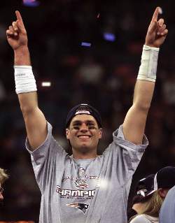Image of SUPER SON - Tom Brady, quarterback of the NFL's New England Patriots, celebrates after a Super Bowl victory. Brady's namesake father, Tom Brady Sr., is a California businessman and a devout Catholic. Brady Sr., in a speech last spring at the seventh annual Worcester Diocesan Men's Conference in Worcester, Mass., challenged Catholic men to use their faith to deal with life's pressures. (CNS photo/Mike O'Connell, Catholic Free Press)