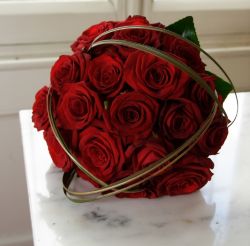Image of ROSES ARE RED – Roses are a traditional gift indicating love and romance any day of the year but particularly on Valentine's Day. The late medieval custom of exchanging love notes on St. Valentine's Day has little to do with saints and is thought to have developed from the belief that the day marked the start of the mating season of birds. Author Mary Carty says woe to those who fail to make the time observe Valentine’s Day as a special opportunity to show one’s spouse a token of love. (www.freedigitalphotos.net)