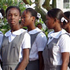 Image of Haitian schoolgirls line up for Sunday Mass at Notre Dame Cathedral in Cap-Hatien, Haiti, last October. Photo by Rick DelVecchio.