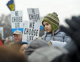 Image of Ernest Garcia, a seminarian at the Archdiocese of Philadelphia, pauses before taking part in the annual March for Life, Friday, Jan. 22, 2010.