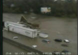 Image of 21 are dead in Tennessee alone. One died after sitting in interstate traffic blocked by flood waters for over five hours, and 10 more died in Mississippi and Kentucky. Four are still missing. 