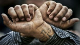 Image of Egyptian Copts wear tattoos such as this cross, which Libyans are using as evidence of guilt. 