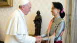 Image of Pope Francis met with Aung San Suu Kyi and praised her non-violent approach to change. 