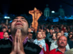 Image of Egyptian Christians pray for peace amid violence in their country. 