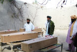 Image of Victims of drone strikes lay in caskets awaiting burial. The administration will not disclose how it chooses targets and if it does anything to prevent civilian casualties. 