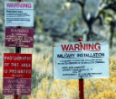 Image of Various signs warn would-be visitors away. None refer to Area 51 itself, but rather Nellis AFB. 