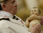 Image of Pope Francis carried the heavy statue of infant Jesus himself, no retinue required. 