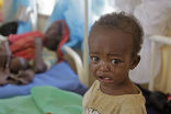 Image of A hungry child weeps. Such scenes may become more common not less by 2050.