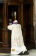 Image of Pope Francis kneels before an ordinary priest to make his confession. 