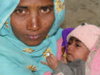 Image of Bought and sold, this woman and her child have a bleak future. And nobody is coming to the rescue. 