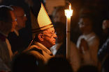 Image of Pope Francis enters with his candle symbolizing the light of Christ. 