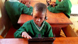 Image of Kids enjoy using tablet computers for learning and are greatly enriched by its expanded capabilities. 