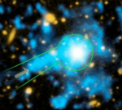 Image of This image from Caltech shows a filament of gas streaming towards a quasar, which is a supermassive, energetic black hole at the center of a galaxy. 