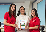 Image of Michelle of CTG, Sister Susana, principal of OLGS, and Lucia of CTG.