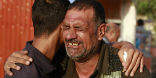 Image of Christians in Mosul embrace one another as they are forced to leave absolutely everything behind at gunpoint. 