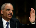 Image of Eric Holder may be fleeing the heat he's feeling for his refusal to cooperate with Congress. 