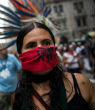 Image of A woman protests the development of the tar sands pipeline through the United States. 