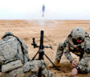 Image of U.S. troops firing a 60mm mortar.