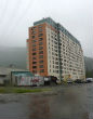 Image of Inside the 14-story building rests a police station, school, post office and health clinic. 