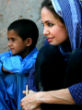 Image of Angelina Jolie spending time with the children in one of her humanitarian missions.
