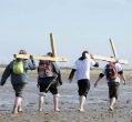Image of Pilgrims in Scotland make a Good Friday trek burdened with crosses. Many Catholics around the world still make pilgrimages, even if they are the work of just a day. 