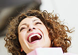 Image of Woman laughing out loud.