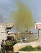 Image of A cloud of poison gas erupts from a bomb exploded by Iraqi demolition experts in March 2015. Officials fear the Islamic State could find a hidden stockpile of chemical weapons or worse, are manufacturing their own. 