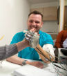 Image of Man feels through the use of prosthetic hands.