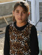 Image of 9-year-old Shilan held her father's headless body following his execution by ISIS soldiers (Owen Holdaway).