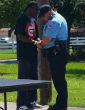 Image of Amey and Chapa pray (Texas City Police Department Facebook).